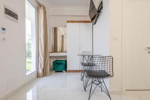 a living room with two chairs and a table at Golden Hill Ksamil in Ksamil