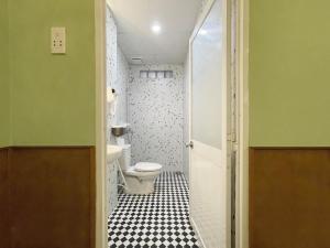 a small bathroom with a toilet and a sink at 5 homestay central in Vung Tau +31 photos