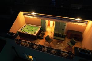an overhead view of a room with a pool table with avertisement at Heritage Holiday Home Rafica 365 Wellness Retreat in Božava