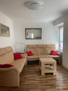 a living room with a couch and a table at Haus Janne in Zell an der Mosel