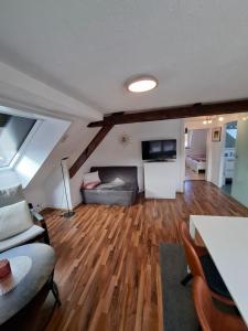 a living room with a couch and a table at Ferienwohnung Jule in Grenzach-Wyhlen