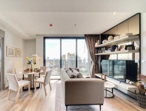 a living room with a couch and a table at Andromeda Condominium Pattaya in Pattaya South