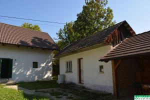 two white buildings with a brown roof at Chalúpka na Podkylave in Podkylava