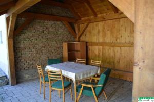a table and chairs on a patio at Chalúpka na Podkylave in Podkylava