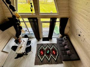 an overhead view of a living room with a table and chairs at Шале WeLKoMe in Verkhovyna