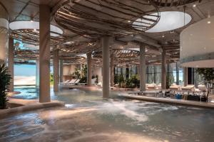 a swimming pool in a building with a swimming pool at Mountain Residence 4* in Bukovel