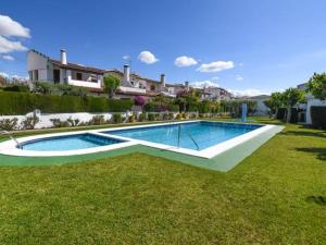 a swimming pool in the yard of a house at Casa Socias in Comarruga