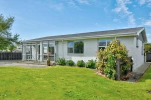 a house with a lawn in front of it at 3 bedroom hidden gem in Gore