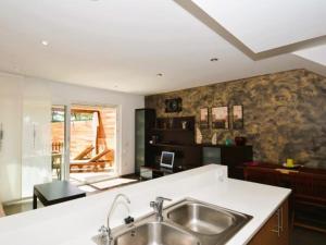 a kitchen with a sink and a counter top at Casa Rosalia in Roda de Bará