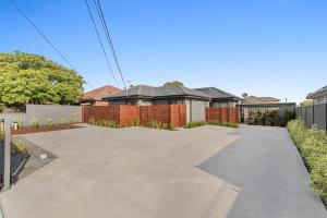 a driveway in front of a house at Gorgeous 3-Bed House with Spacious Shared Backyard in Carnegie