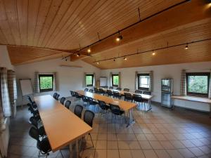 a large room with tables and chairs in it at Ferienhaus Eichhörnchennest in Waldbrunn