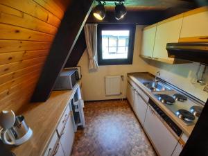 a small kitchen with a sink and a window at Ferienhaus Winnetou 114 in Waldbrunn