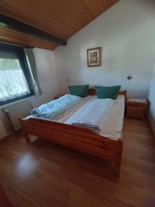 a large bed in a room with at Ferienhaus Abendgold in Waldbrunn