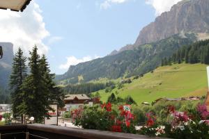 a view of a green valley with mountains at Garni Villa Linda in Corvara in Badia