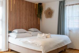 a bed with two pillows on it in a bedroom at Hamr Divci Kamen in Křemže