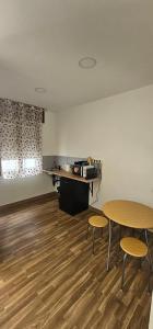 an empty room with a table and two chairs at Apartamento San Simón in Redondela