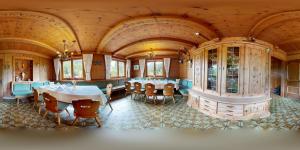 a dining room with tables and chairs in a building at Gasthaus Steinberg in Westendorf +59 photos