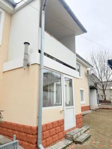 a house with a white door on the side of it at Hostel Chisinau Centru in Chişinău