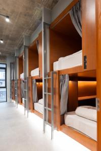a row of bunk beds in a room at Once Again Hostel in Bangkok +71 photos