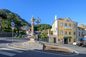 a street with a street light in the middle of a city at Casa Mariana 2 - Sintra, Apartment in Sintra