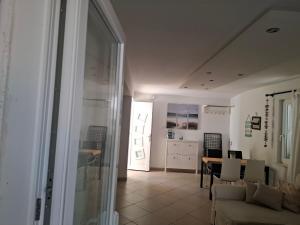 a living room with a couch and a table at Gavza Luna Apartment in Cres +37 photos