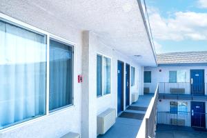 an empty building with windows and a balcony at Motel 6-Pleasanton, CA in Pleasanton