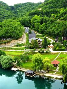 an aerial view of a house on a lake at Mountain Holiday Homes in Kostel