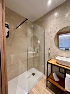 a bathroom with a shower and a sink at Hotel Síbel Baza in Baza +46 photos