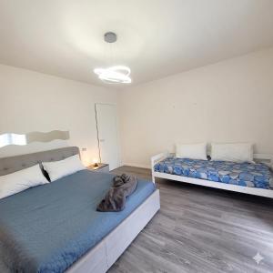 a bedroom with two beds in a room at Garden Relais Mountain Lake Iseo Hospitality in Solto Collina