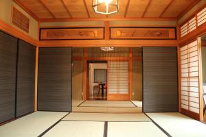 an entrance to a japanese house with doors at Bob's house in Kameoka +81 photos