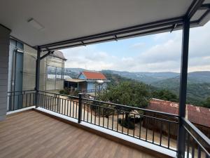 a balcony with a view of the mountains at Mây's Villa in Da Lat