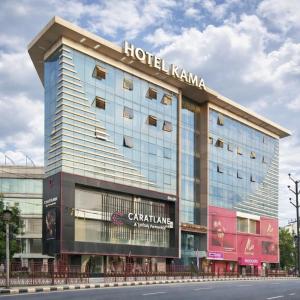 a hotel karma building on the side of a street at Hotel Kama, Patna in Patna