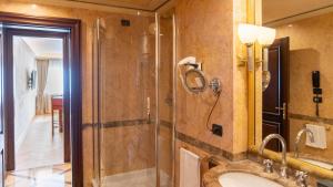 a bathroom with a shower and a sink at River Chateau Hotel in Rome +49 photos