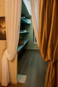 a curtain in a room with a wooden floor at Chalet Le Puy Papillon in Servières-le-Château