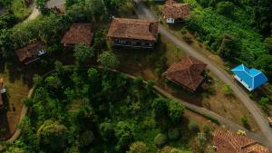 an overhead view of a house with trees and a road at El Lugar Hotel & Nature Reserve Costa Rica in Tigre