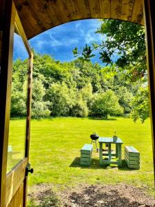 a view of a table and two chairs in a field at Daisy in Battle