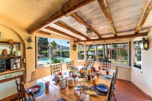 a dining room with a table with food on it at Guest House Villa Verde - Short Term Room Rentals in Torre delle Stelle