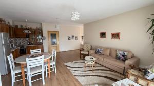 a living room with a couch and a table at Belvedere Centro Shkoder in Shkodër