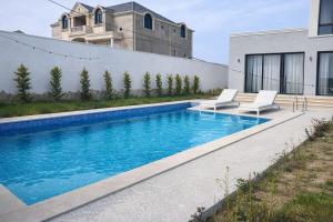 a swimming pool in the backyard of a house at Villa in Mayak in Baku