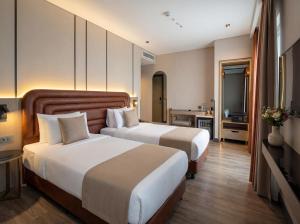 a hotel room with two beds and a television at Edition Old City Hotel in Istanbul +152 photos
