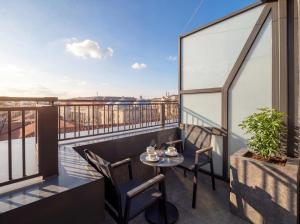 a balcony with a table and chairs and a view at Edition Old City Hotel in Istanbul