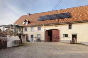 a house with solar panels on the roof at Bachbubenhof in Hüfingen