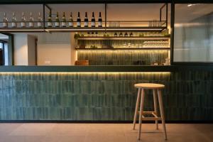 a stool sits in front of a bar at LPM Sporthotel Durbuy in Durbuy