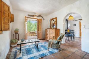 a living room with a table and a dining room at Off-Grid - Puerto Mika in Órgiva +75 photos