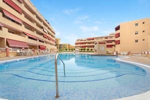 a large swimming pool in the middle of a building at La Casita de Edu in Puerto de Santiago