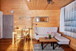 a living room with a couch and a table at Ferien Bei Mari in Schwangau