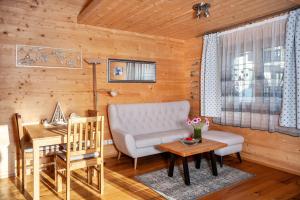 a living room with a couch and a table at Ferien Bei Mari in Schwangau +13 photos