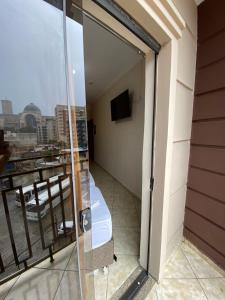 a balcony with a view of a city at Basilica Palace Hotel in Aparecida +31 photos