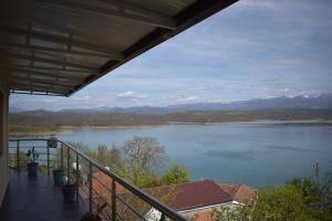a view of a lake from the balcony of a house at Ulza Lake Escape in Ulëz