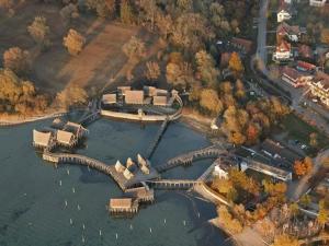an aerial view of a lake with a bridge at Ferienhaus Jäger in Friedrichshafen